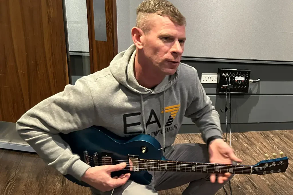 Daz playing guitar